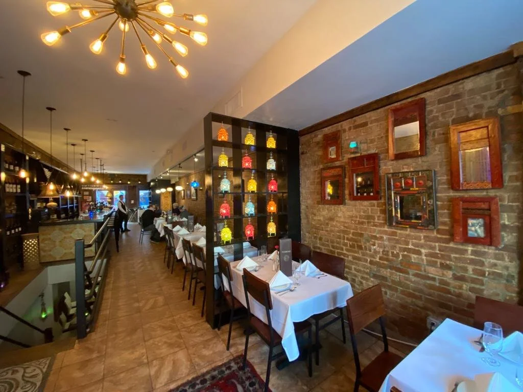 Main dining room — long view under the sputnik chandelier