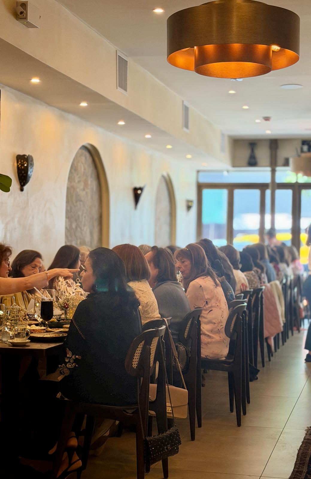 Dining room — luncheon under the brass pendant light